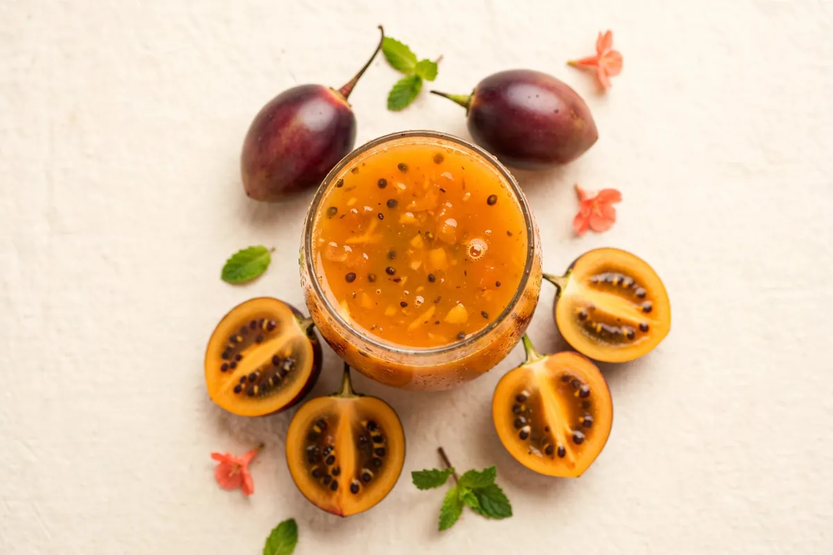 Glass of orange tree tomato (tamarillo) juice